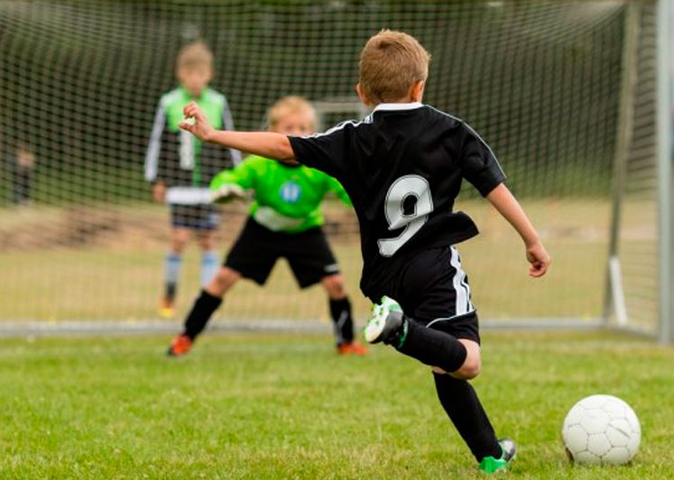 Boys playing football