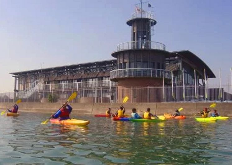 Canoes in front of the Andrew Simpson Watersports Centre